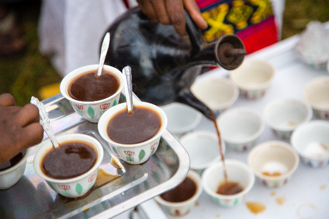 Fresh coffee is shared cup by cup, a small ritual of warmth and hospitality.
